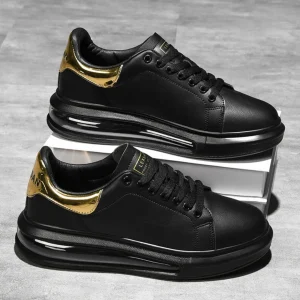 Zapatillas de cuero negro con detalles dorados y suela deportiva®